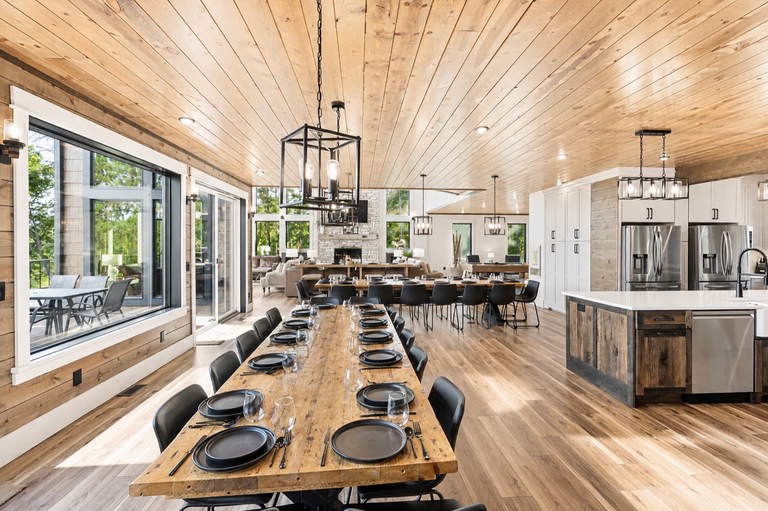The kitchen's island and dining table set for a crowd